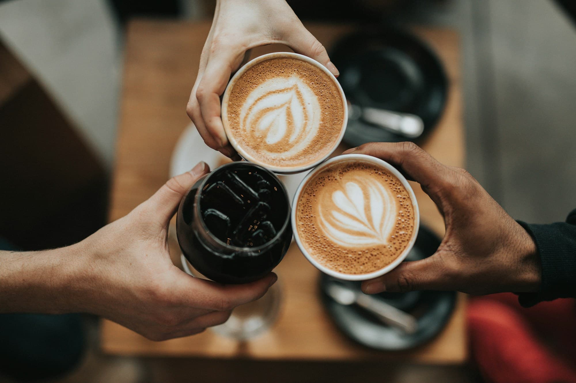 Friends toasting coffee